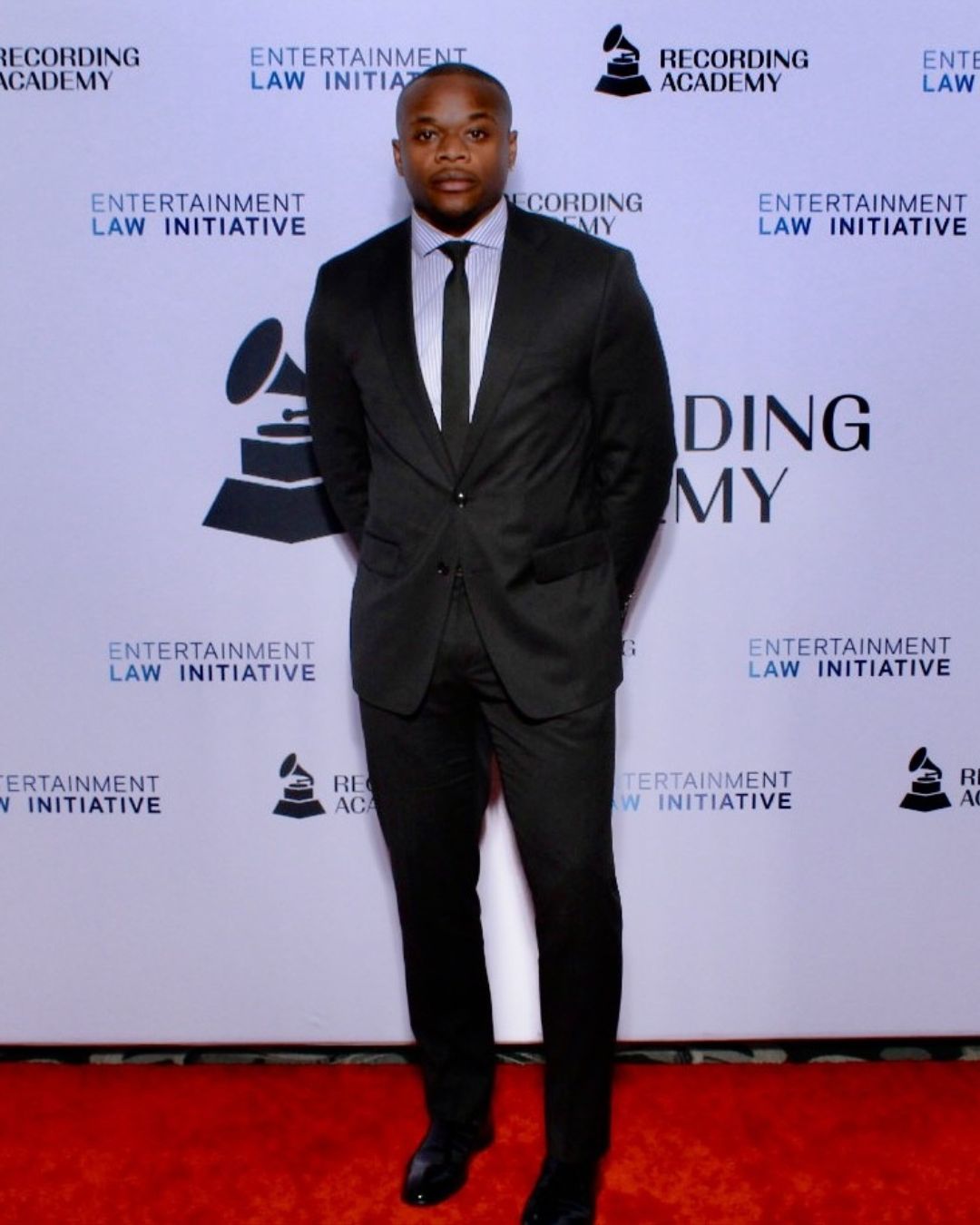 UHLC alum Ugonna Abakwue with caps he designed.
