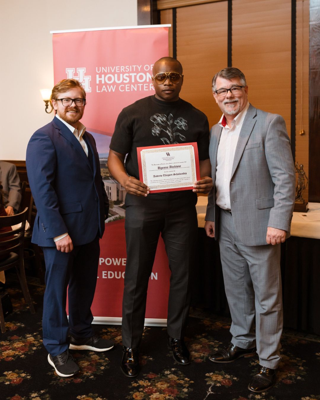 UHLC alum Ugonna Abakwue with caps he designed.