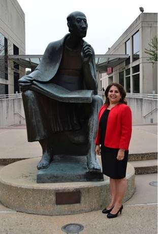 Image may contain: 2 people, people smiling, people standing and outdoor