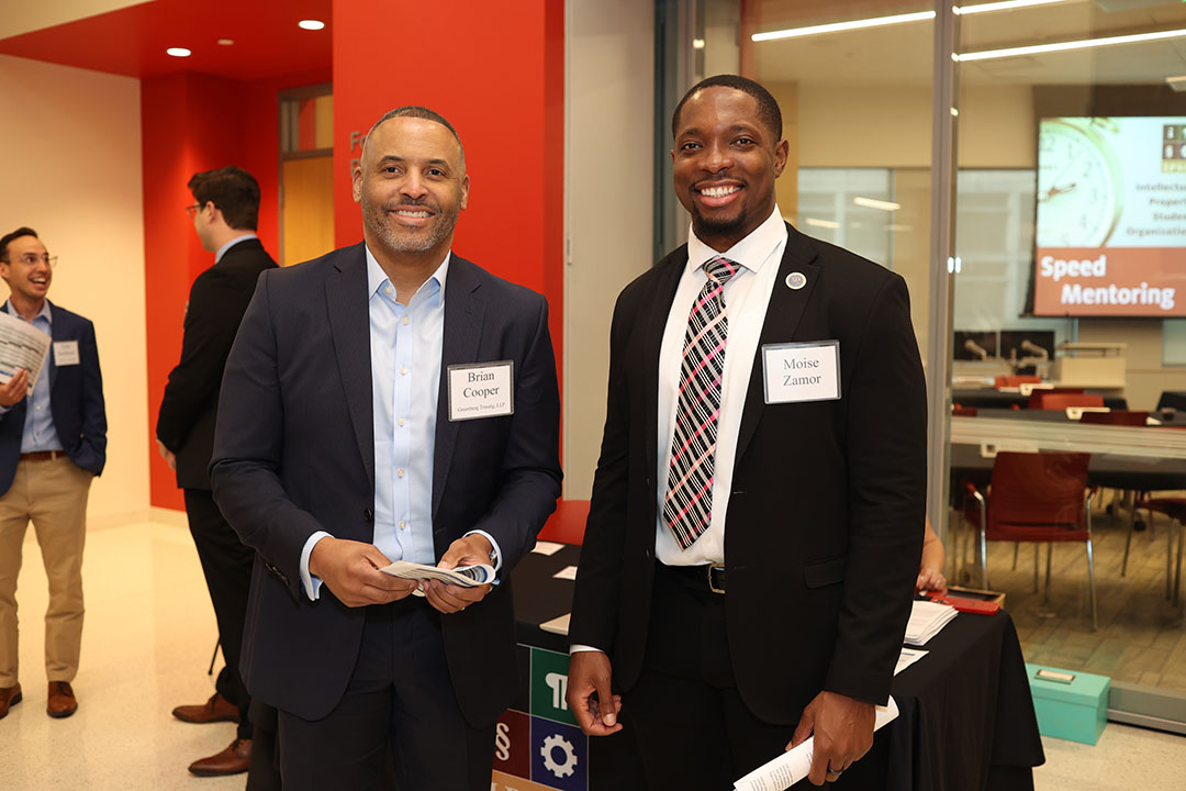 Mentor, Brian Cooper (Greenberg Traurig, LLP) with IPSO student, Moise Zamor