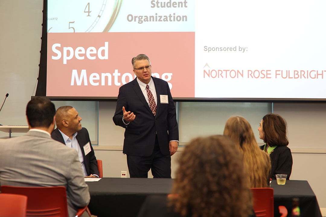 Greg Vetter welcomes everyone to the event, giving thanks to mentors and Norton Rose Fulbright for sponsoring the event.