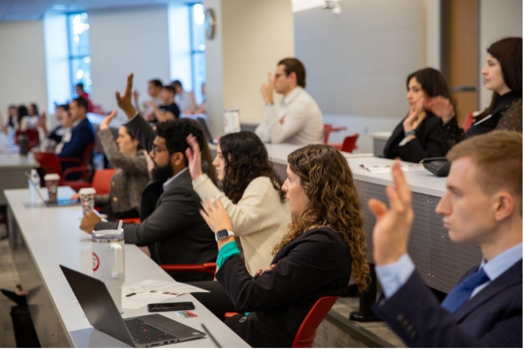 Audience shot of people waiting to ask question