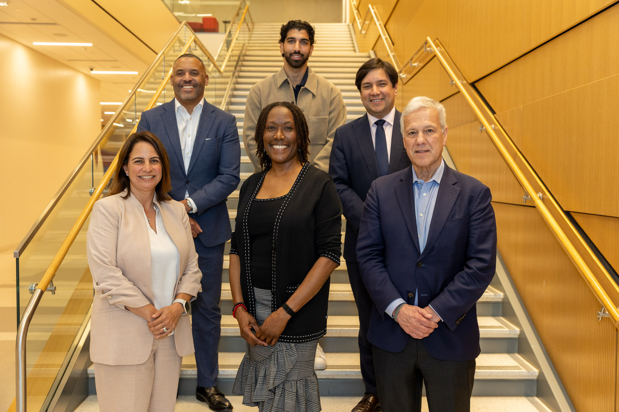 Conference speakers and participants gathered on staircase at UH Law Center